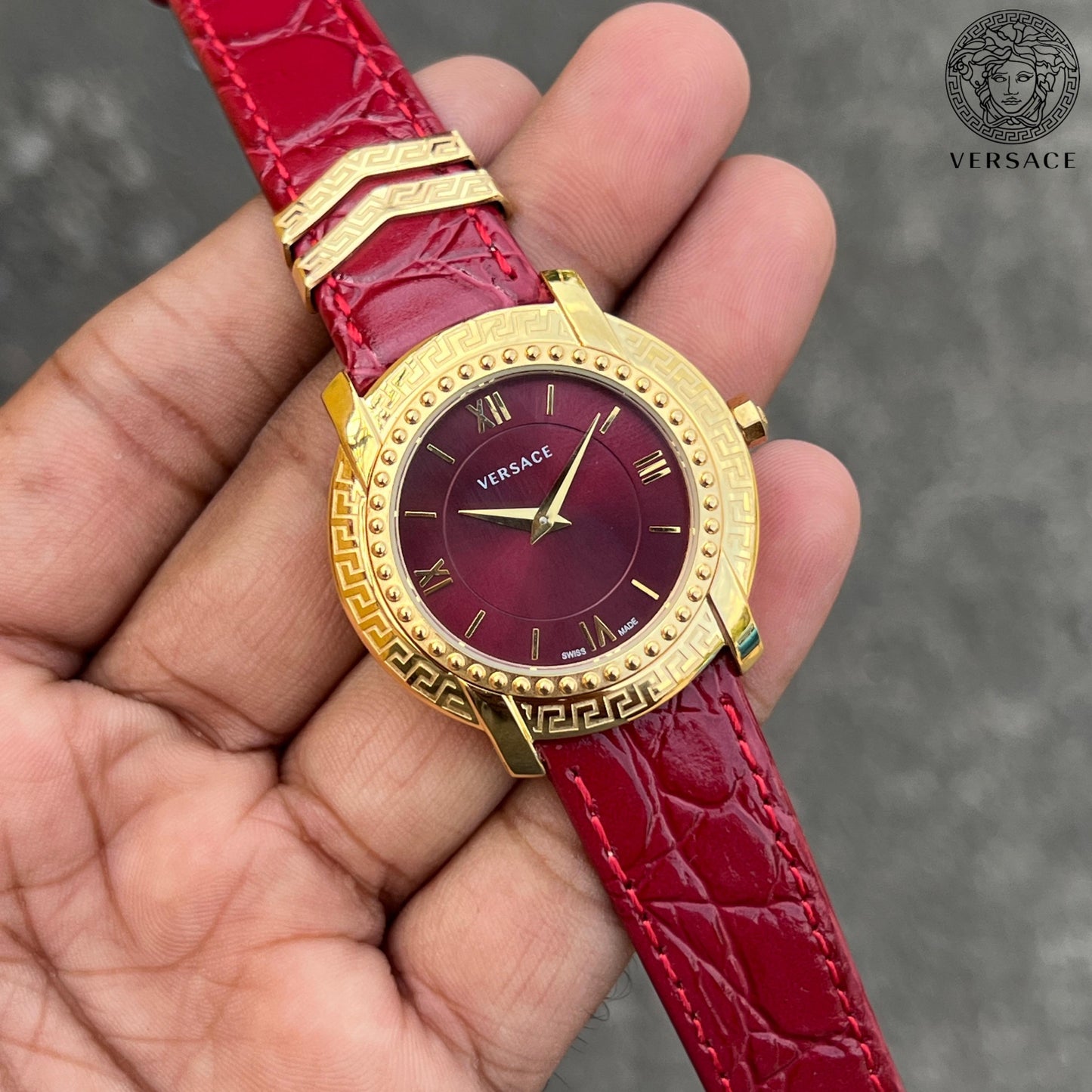 Versace DV25 Round Gold Women's Watch with Red Dial