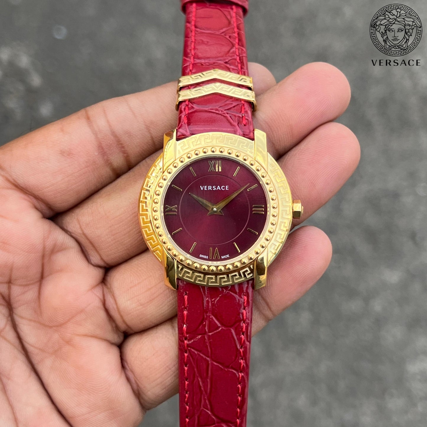 Versace DV25 Round Gold Women's Watch with Red Dial